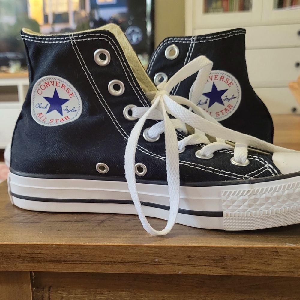 Black pair of high-top Converses